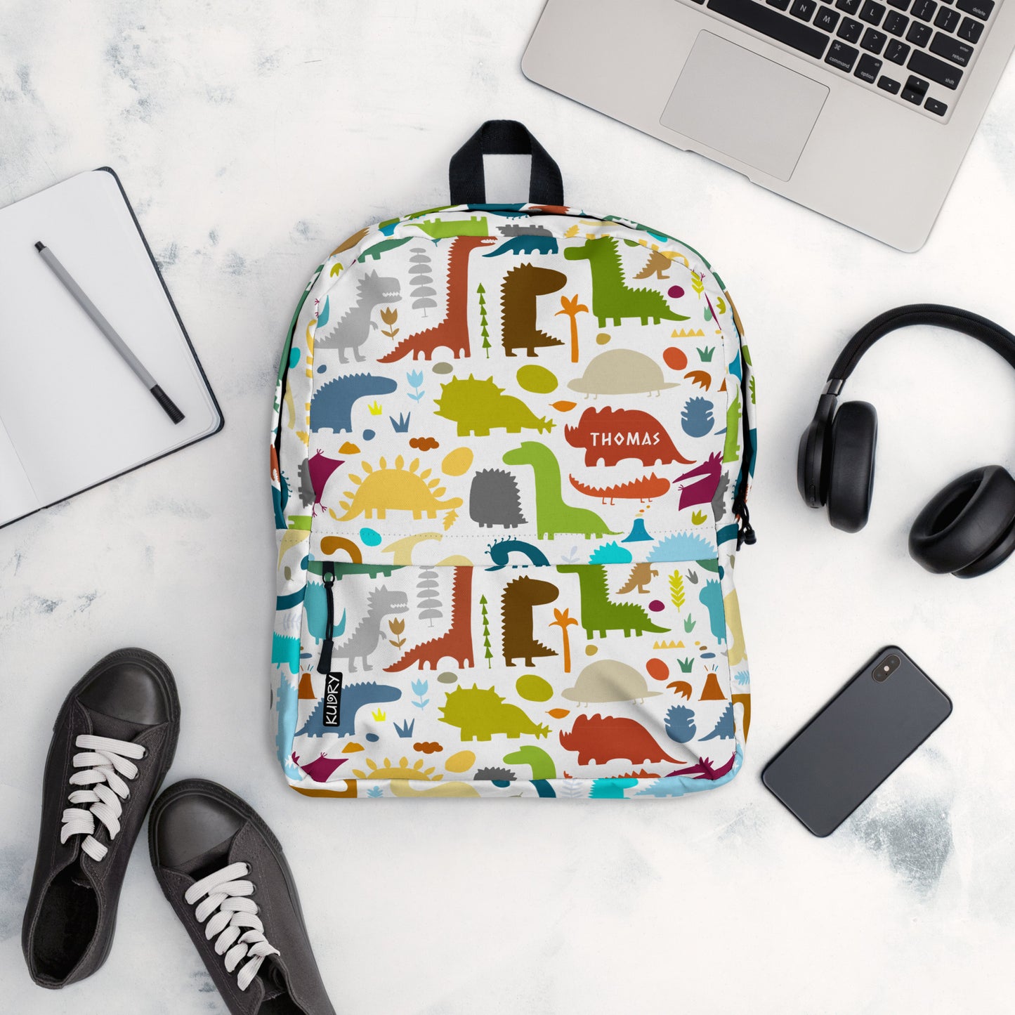 Paleontology Backpack white with colorful Dinosaurs designer print and personalised text. Top view