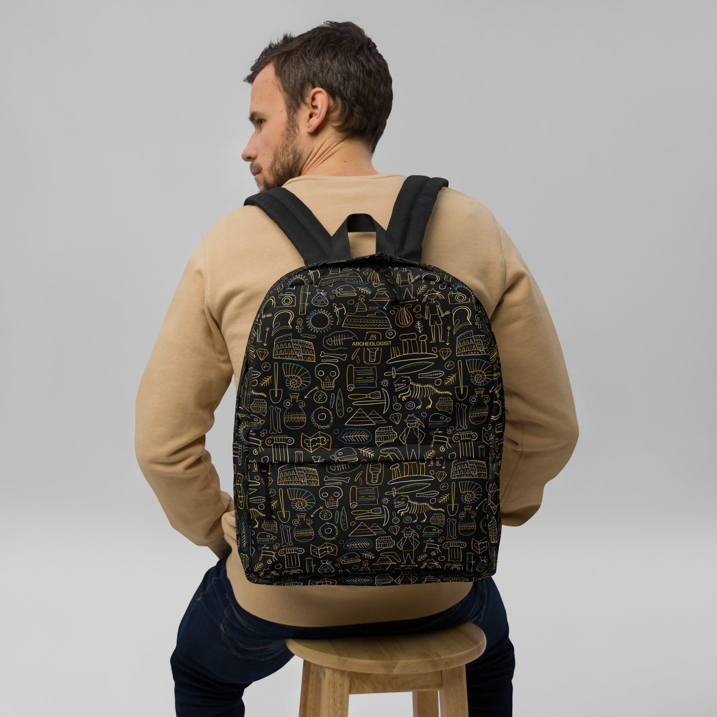 Man with Personalised Backpack for Archeology lover, stylish designer print on black. Basic text you can change - Archeologist
