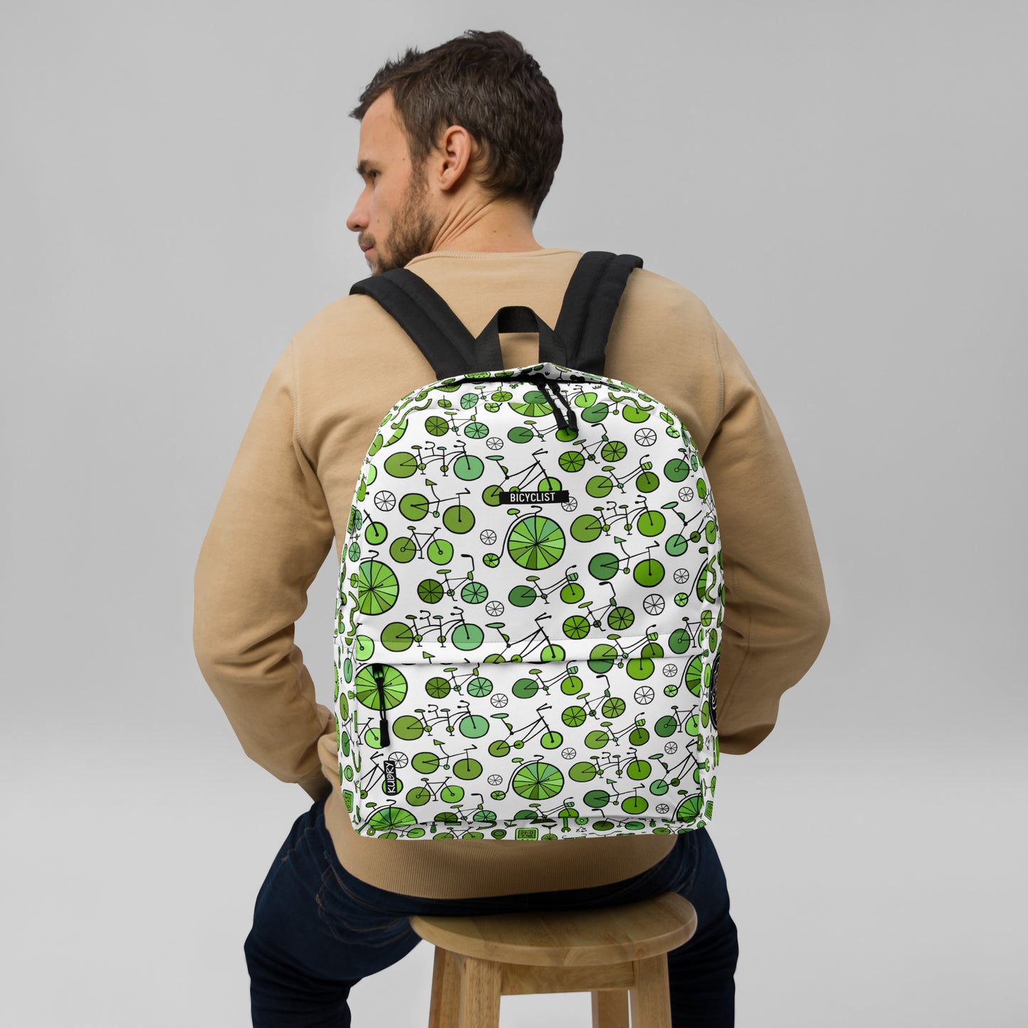 Man with  Backpack with green bicycles collection. Bicyclist