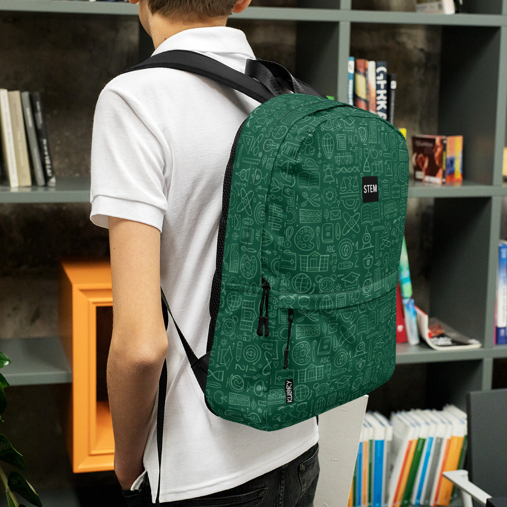Boy in library with Personalised School Backpack dark green color,  STEM-themed, stylish designer print 