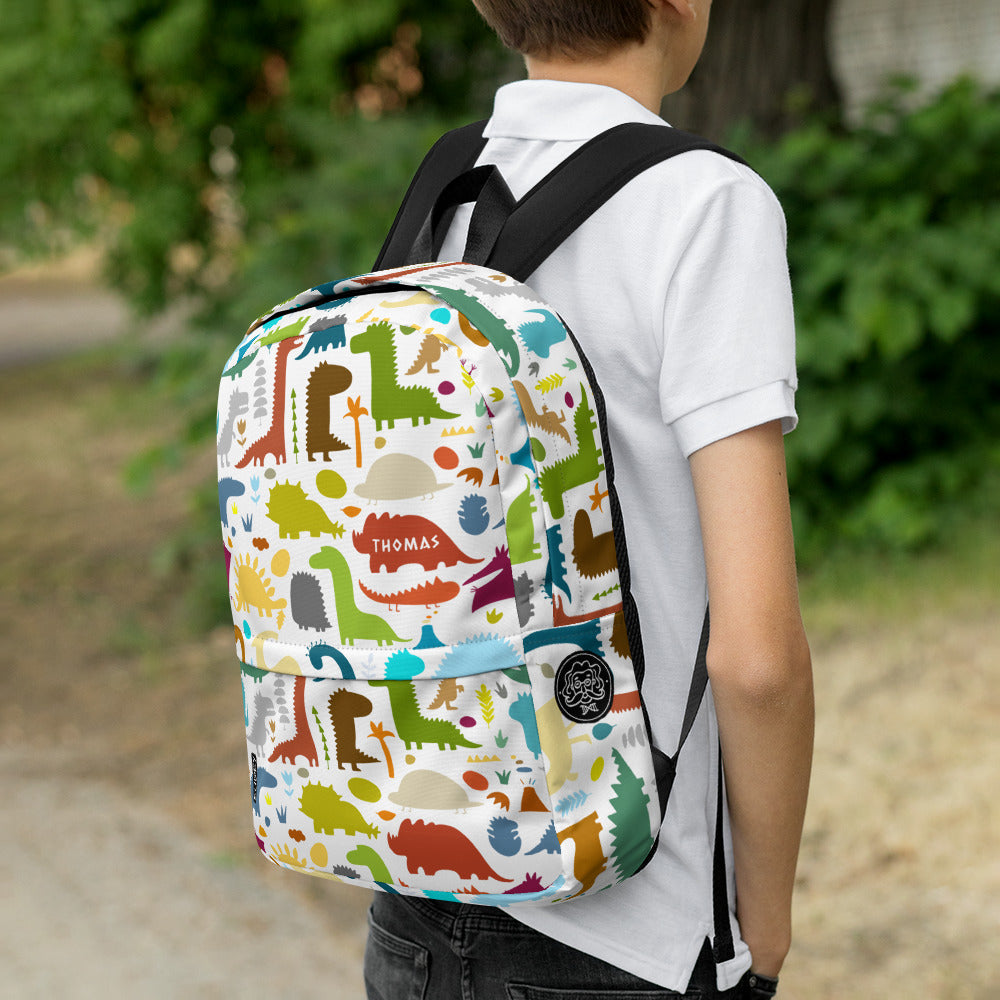 Boy with Paleontology Backpack white with colorful Dinosaurs designer print and personalised text