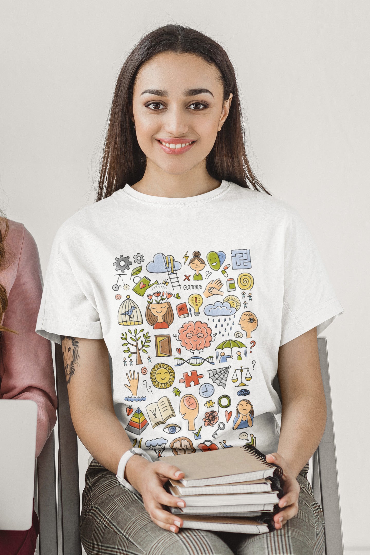Woman with books in white t-shirt with funny concept art print about Psychology