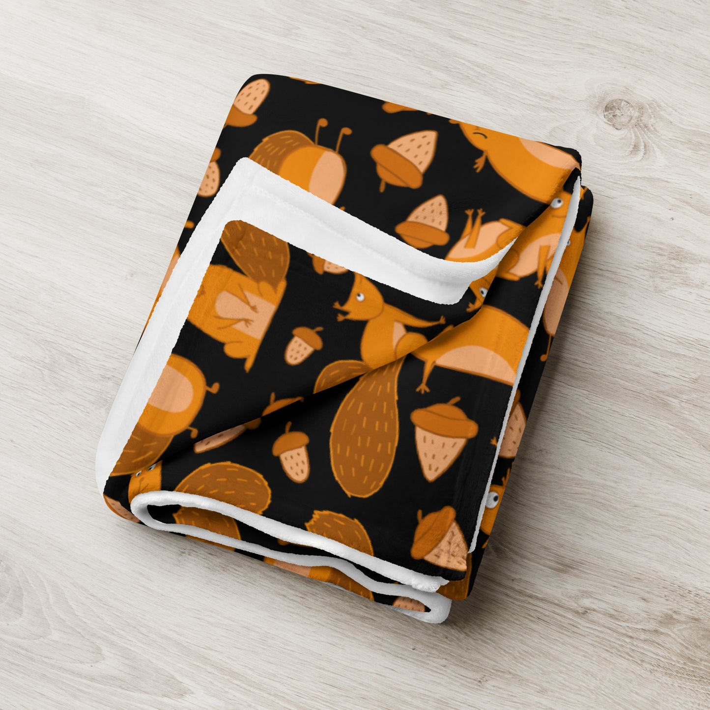 Throw blanket black color with funny orange squirrels and nuts