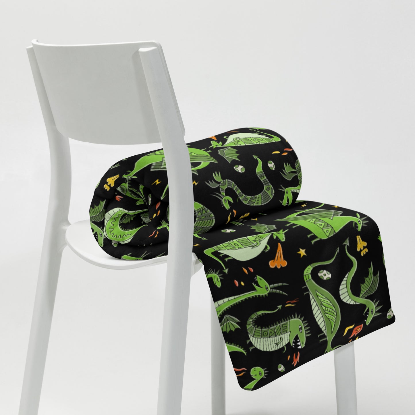 Black blanket 50x60 with funny green dragons on chair