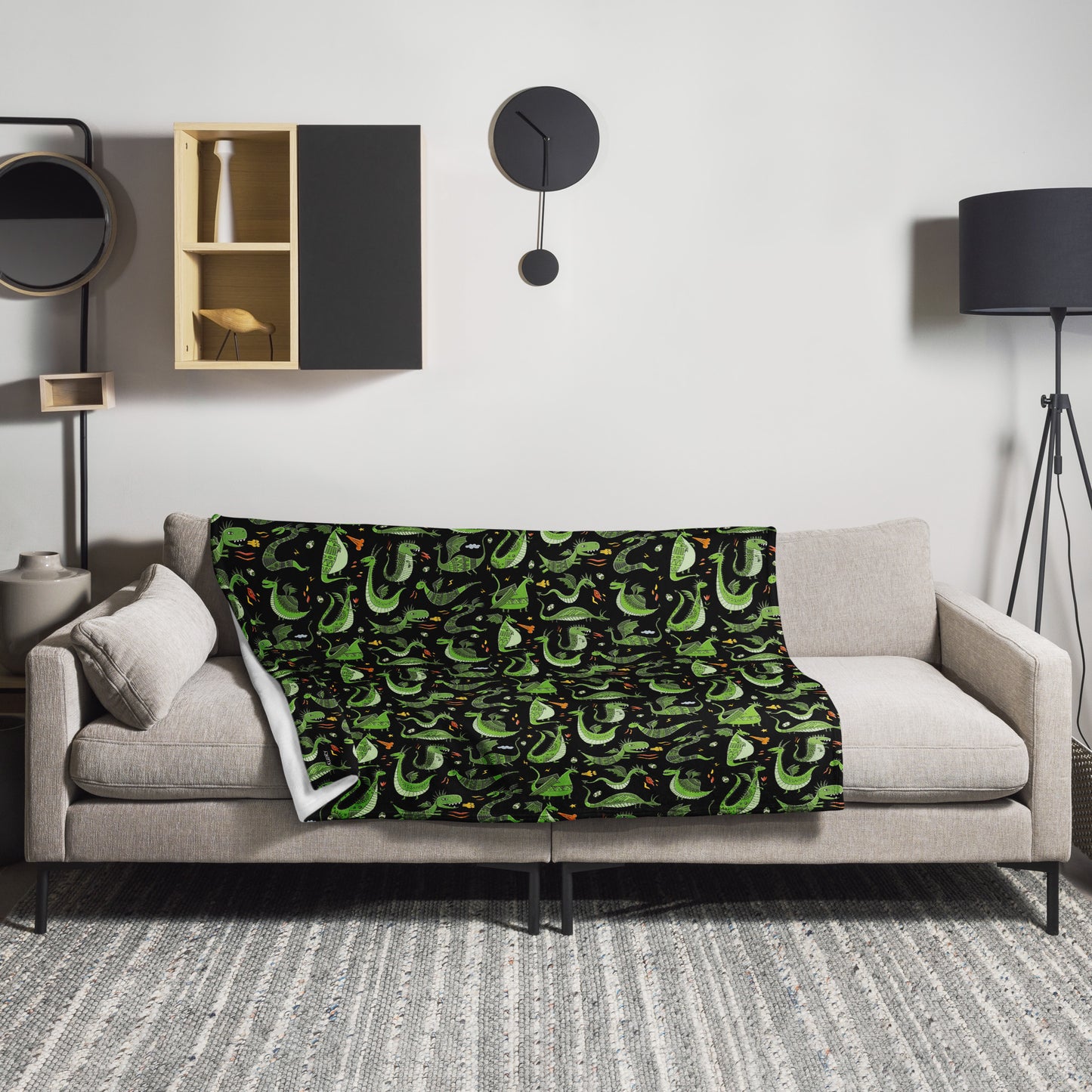 Design Interior with Black blanket 50x60 with funny green dragons on sofa in the room