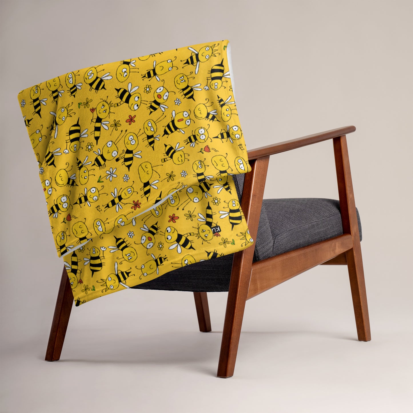 Bee blanket used as decorative throw in a bedroom interior