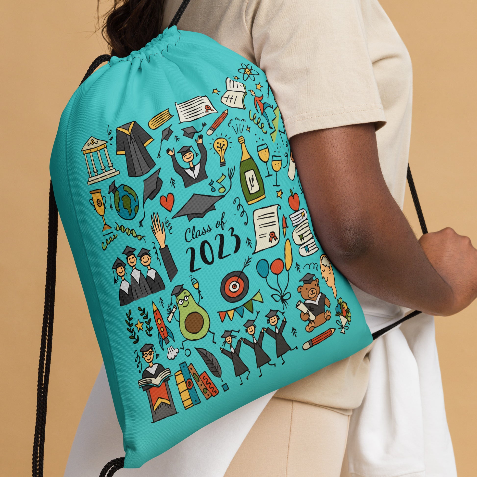 Girl with customised graduation drawstring bag with funny designer print featuring graduates in hats and mantles, school-themed motifs, and a graduation teddy bear. 